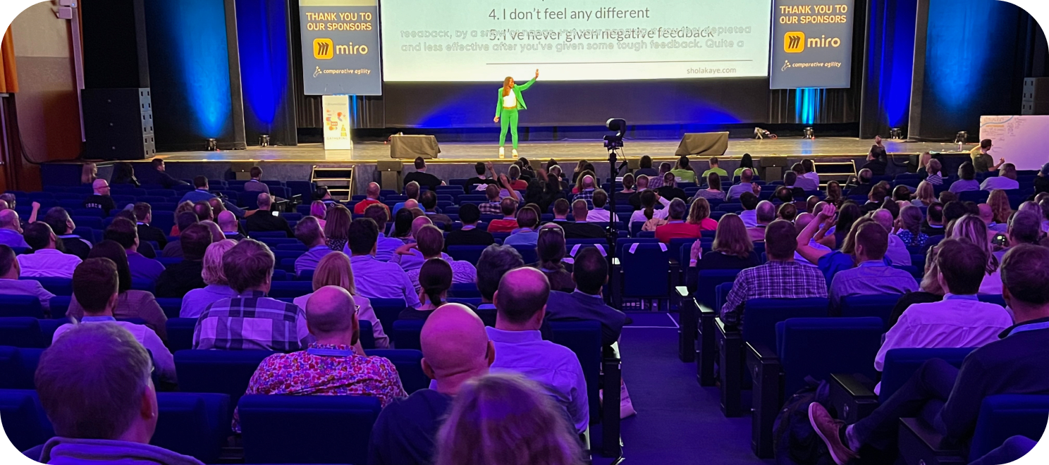 An Agile speaker presenting to a full room of audience members