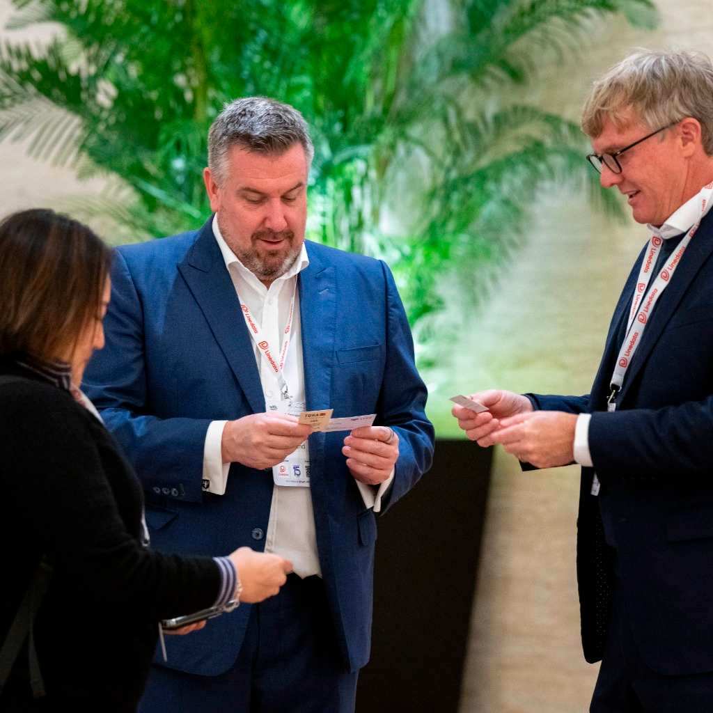 Delegates exchanging visiting cards at the With Intelligence Hedge Fund COO Summit | APAC