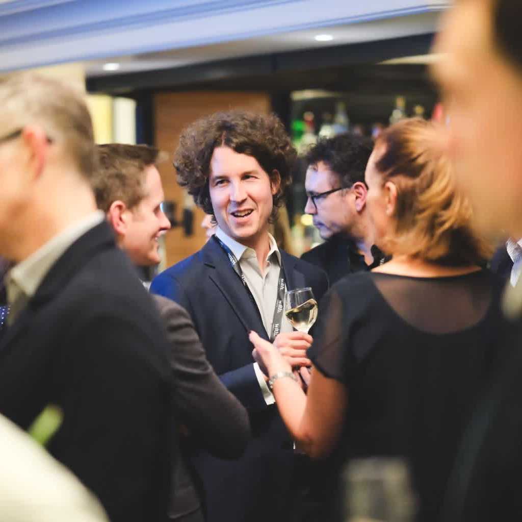 Attendees networking with drinks at the HFM Legal Networking Drinks