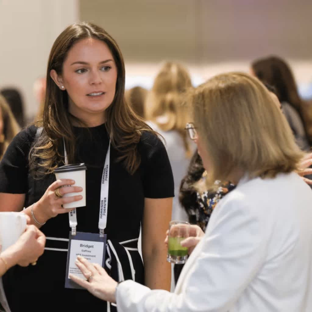 Women in private markets having a drink and networking at the Women’s Private Credit Summit