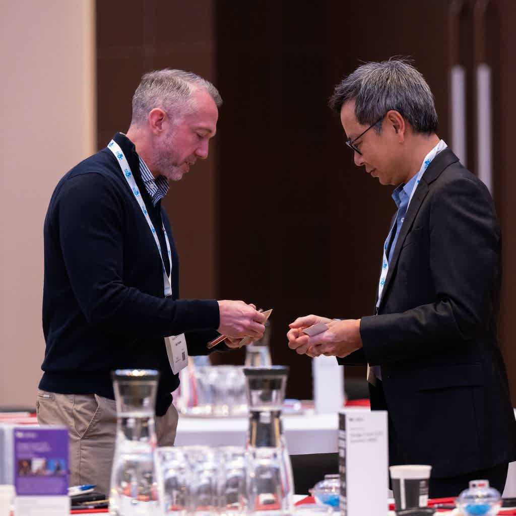 Sponsors exchanging visiting cards at the With Intelligence Hedge Fund COO Summit | APAC
